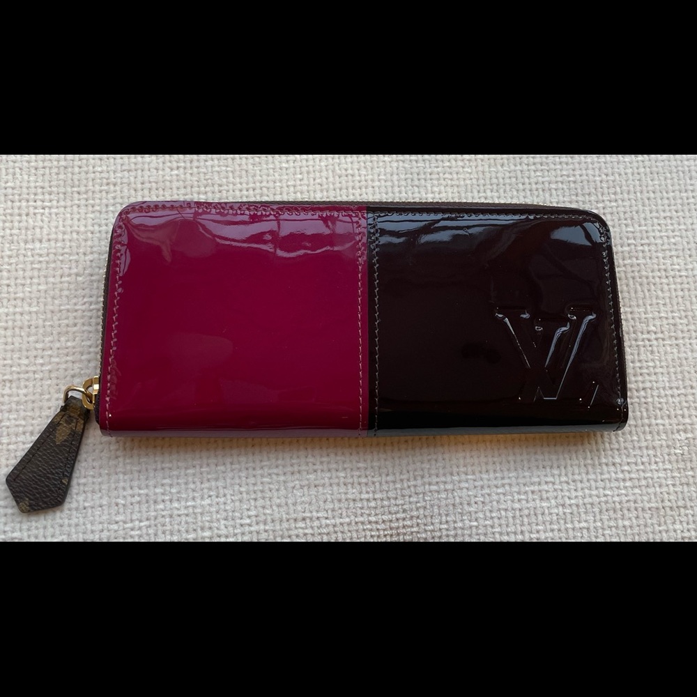 Authentic Louis Vuitton Vernis Clemence Wallet in magenta